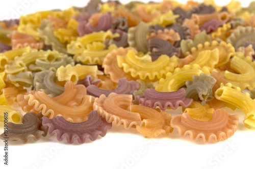 multicolored pasta on white background