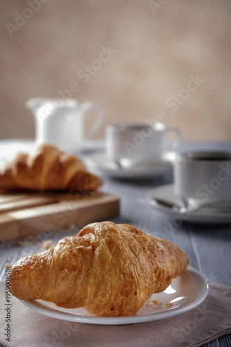 Black coffee and croissants.