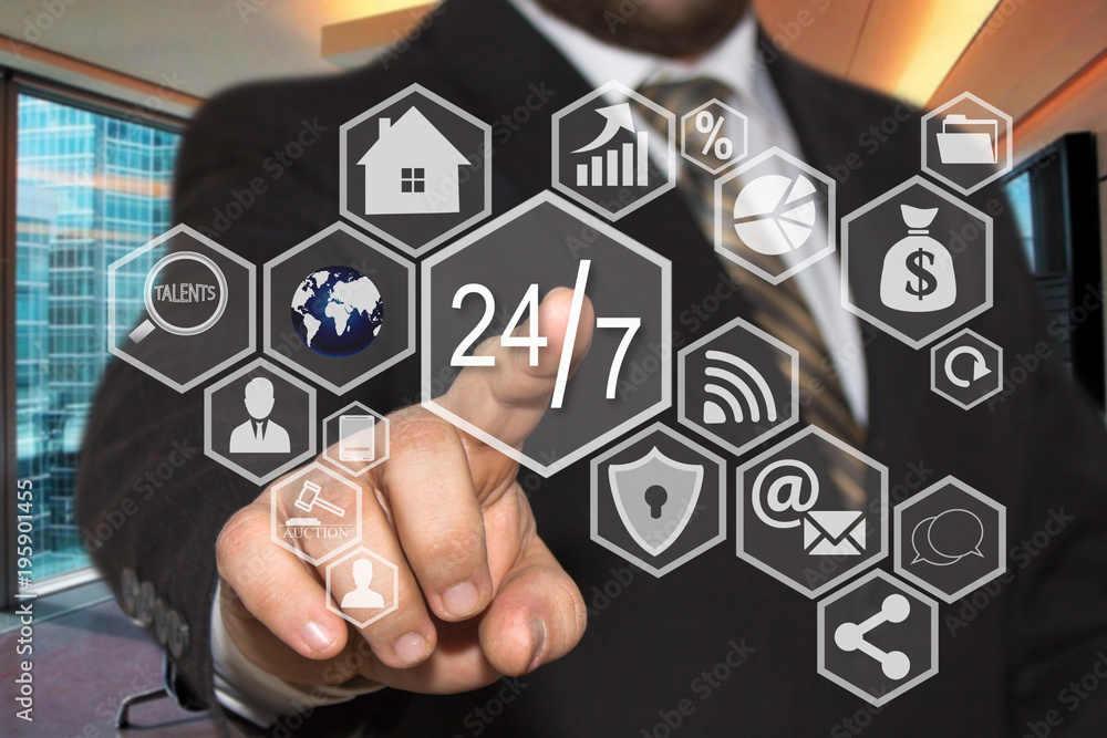 The businessman chooses button 24 hours 7 days web service icon on the touch screen with a futuristic background .The concept 24 hours 7 days web service. The businessman chooses button 24 hours 7 days web service icon on the touch screen with a futuristic background .The concept 24 hours 7 days web service.