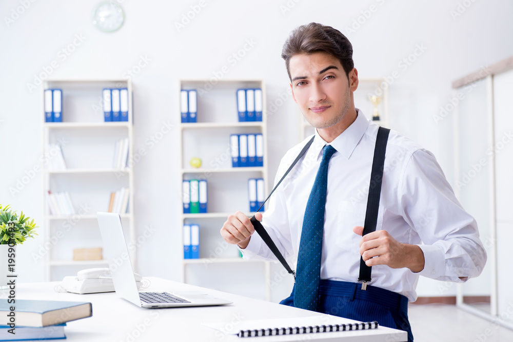 Young stylish businessman working in the office Young stylish businessman working in the office