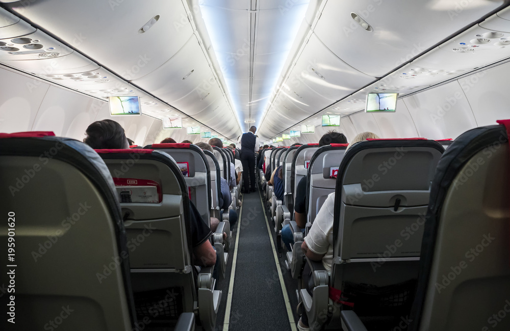 A view of the corridor on the interior of a flight in a day flight on the 29th of the July, 2017 A view of the corridor on the interior of a flight in a day flight on the 29th of the July, 2017