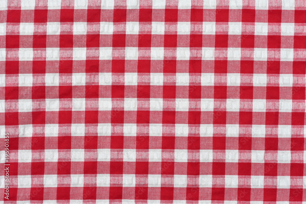 Red classic checkered tablecloth , background with copy space Red classic checkered tablecloth , background with copy space