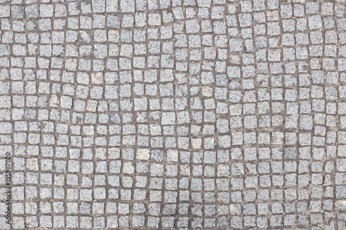 Bilde på lerret Abstract background of old cobblestone pavement view from above