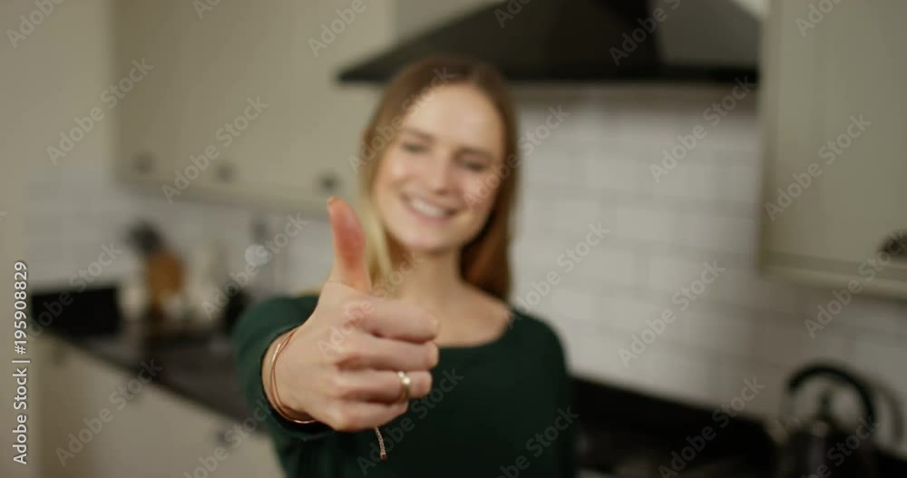 4K Beautiful happy young woman giving thumbs up to camera. Slow motion. 4K Beautiful happy young woman giving thumbs up to camera. Slow motion.