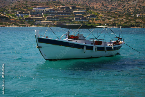fishing boat at the blue Mediterranean sea water