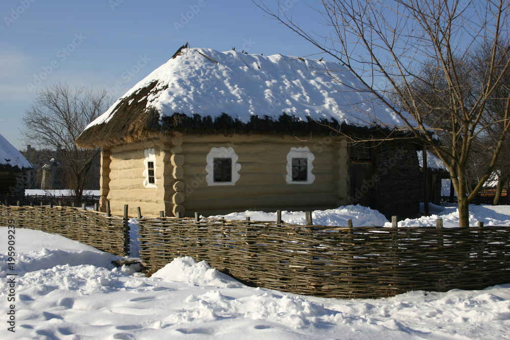 old village house in the snow winter