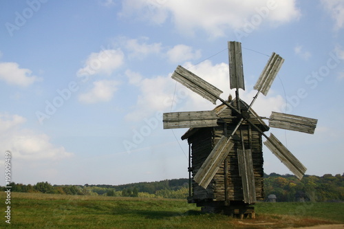 old wood windmill in the field