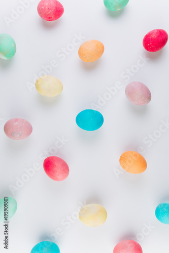 Preparation for Easter. Сolored eggs on a blue background, flat lay and top view. © anatoliycherkas