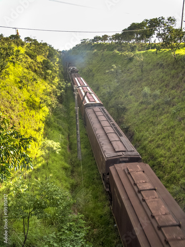 Train runs through a narrow gorge in the valley, in Sao Paulo state, Brazil