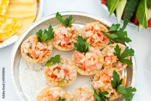 Tartlets with meat, tomatoes and cheese
