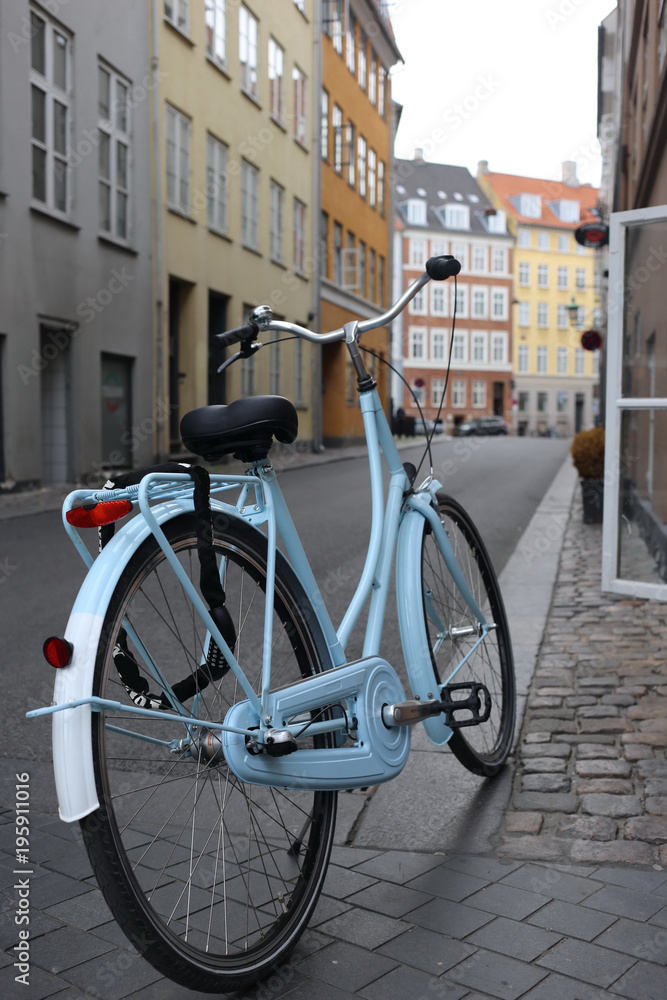 blue bicycle at the street of the city Copenhagen Denmark