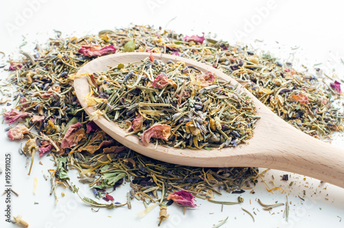 dry herbal tea in wooden spoon