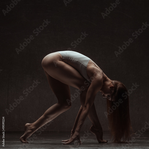 Young gymnast woman stretching and training