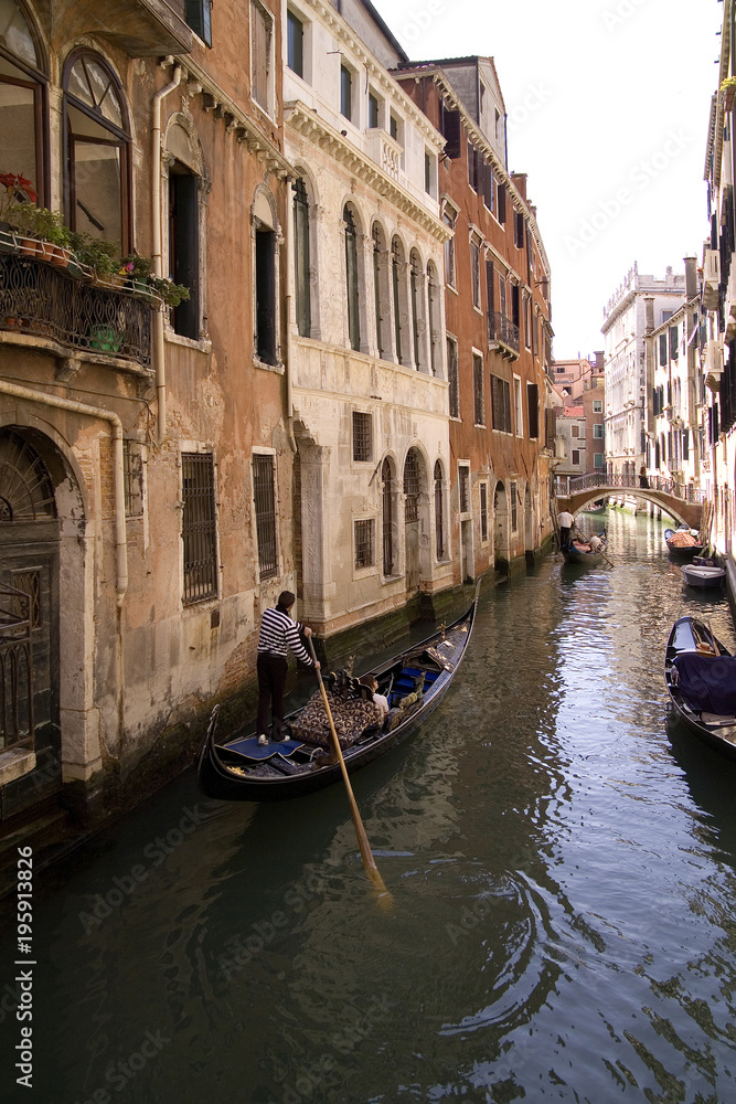 Gondola ride in small canal, Venice Italy