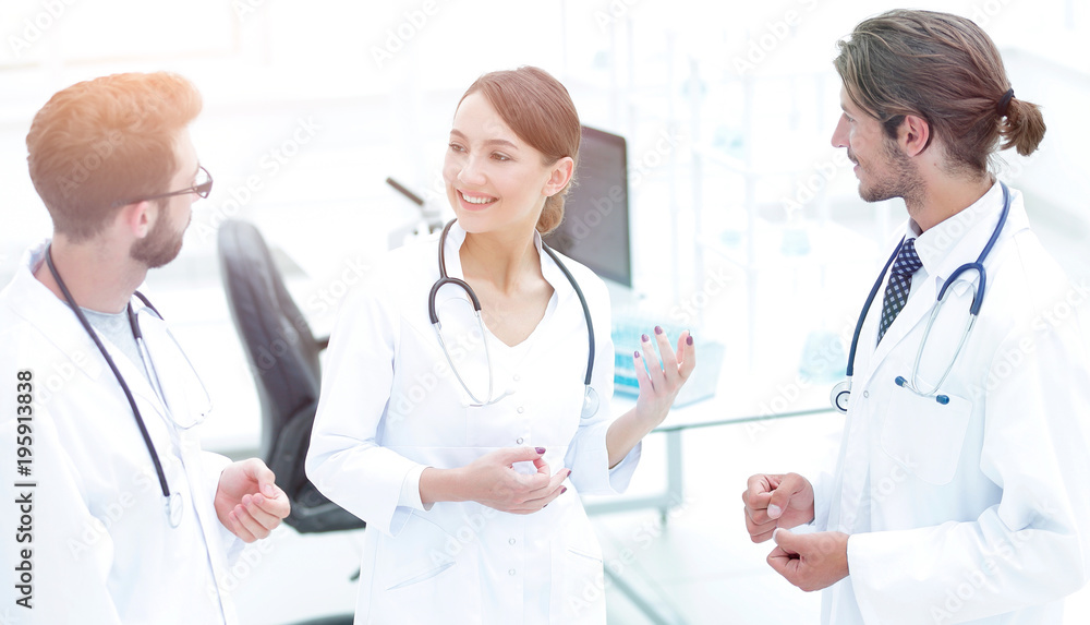 Team of different doctors having conversation Team of different doctors having conversation