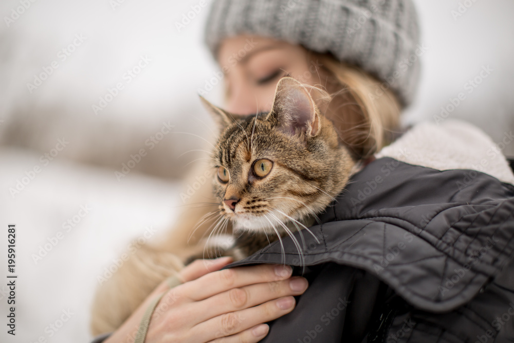 Cat on the women shoulders on the street Cat on the women shoulders on the street