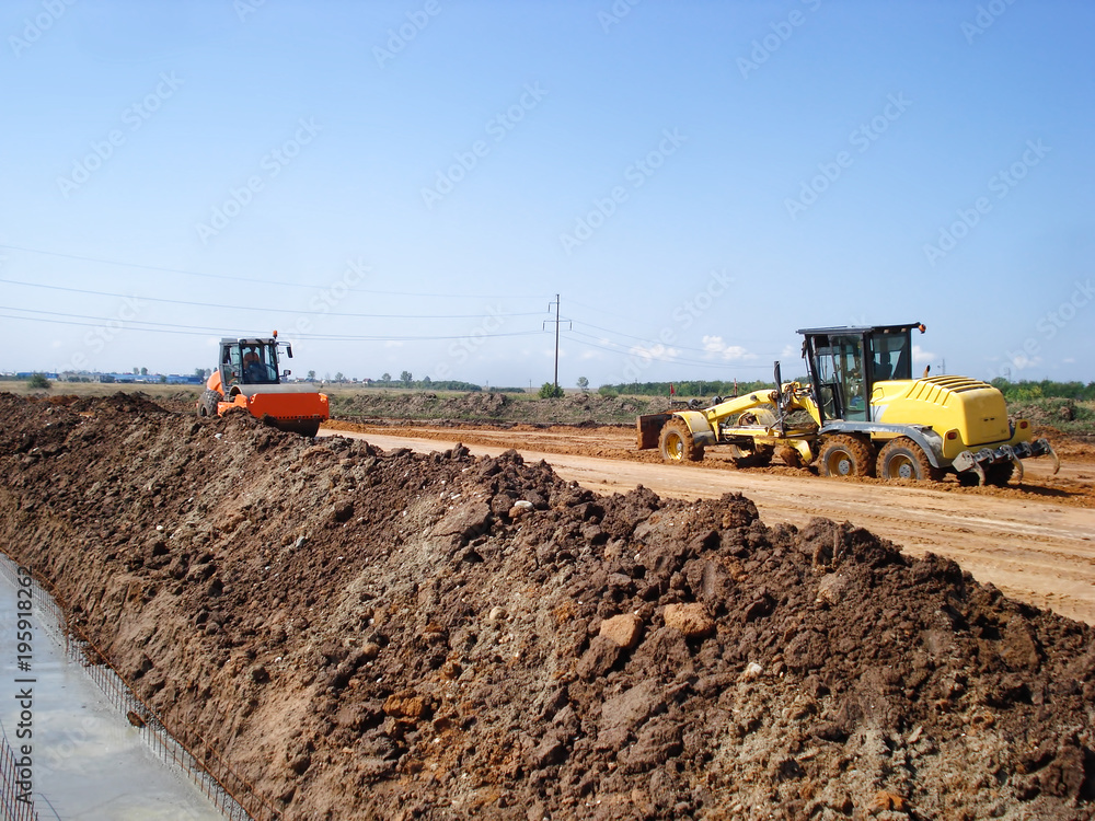 Fototapeta premium Grader and compactor on construction site
