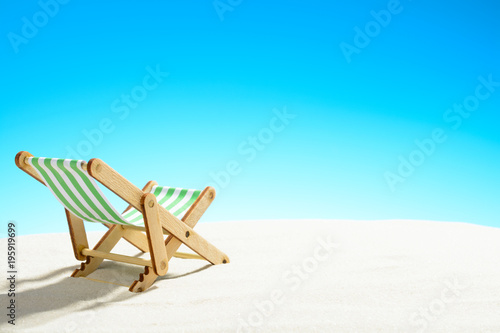 Sun lounger on the sandy beach