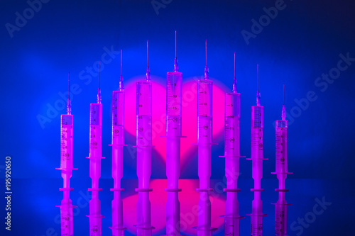 Medical syringes on the bac...