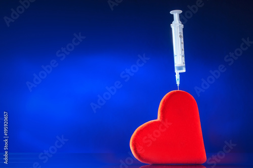 A syringe is inserted into ...