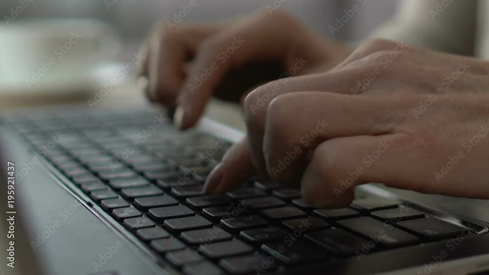 Woman hands typing on laptop keyboard, confident user in elderly age, closeup Woman hands typing on laptop keyboard, confident user in elderly age, closeup