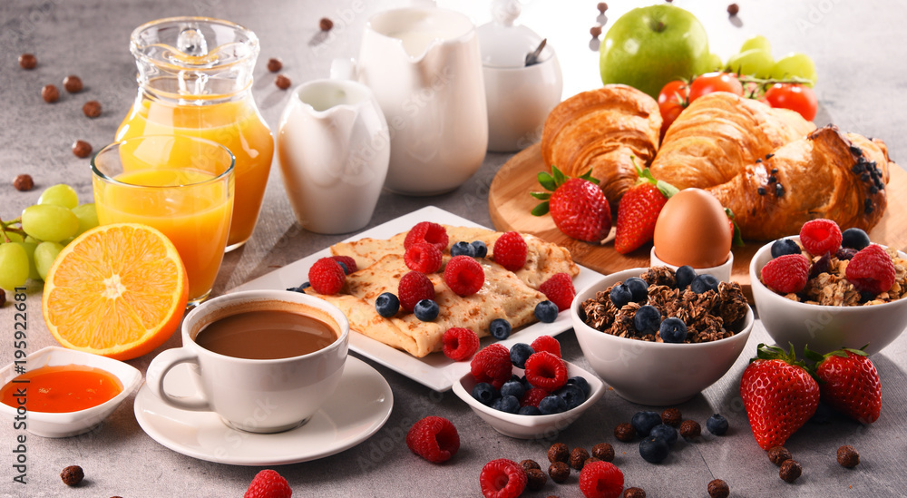 Breakfast served with coffee, juice, croissants and fruits Breakfast served with coffee, juice, croissants and fruits