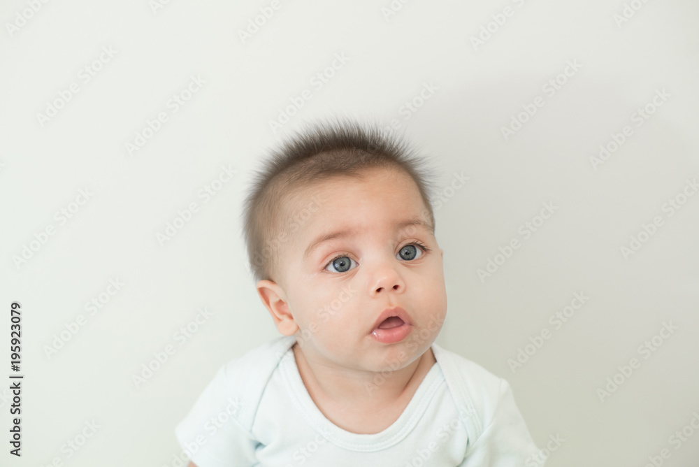 Blue-eyed baby boy on white background - Isolated background