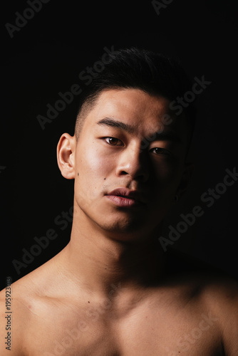 Portrait of young asian boy with fitness body.