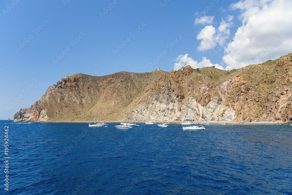 Yachts at the rocky coast of Lipari Island
