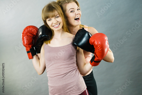Two women friends wearing boxing gloves © anetlanda