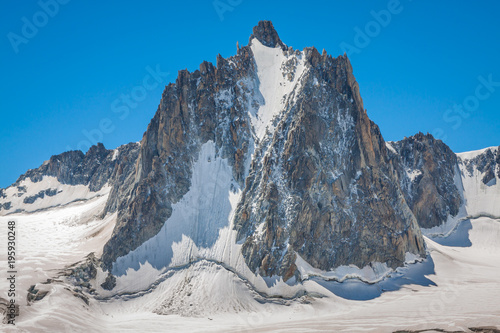 Massif de mont Blanc on the border of France and Italy. In the foreground the ice field and crevasses of the Valley Blanche photo