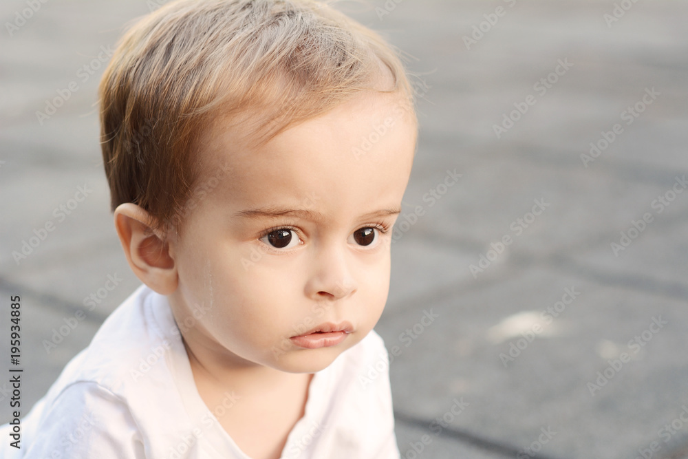 Portrait of baby boy on the street