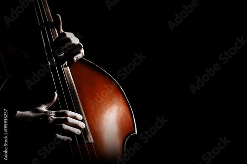 Double bass. Hands playing contrabass player photo