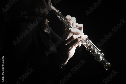 Flute instrument Flutist hands playing flute music photo