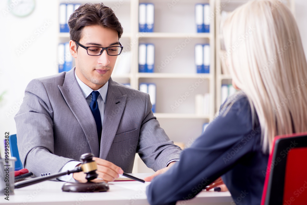 Lawyer discussing legal case with client Lawyer discussing legal case with client