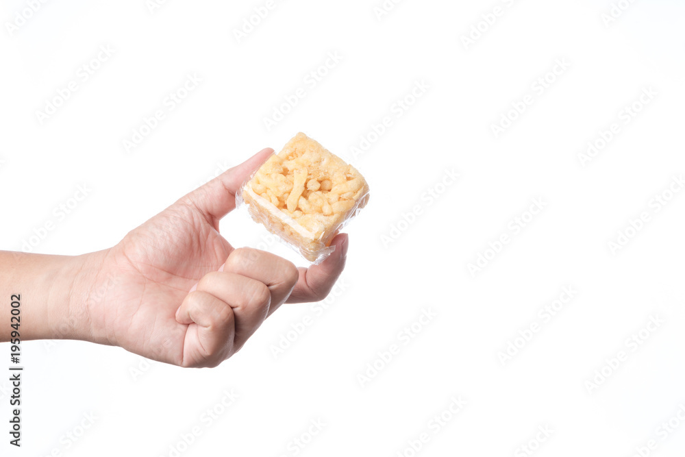 Hand holding khao soi tud, traditional Thai snack Hand holding khao soi tud, traditional Thai snack