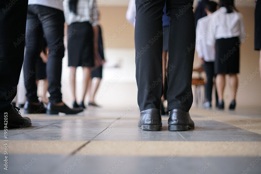 Legs of business man and woman waiting in a row for job interview Legs of business man and woman waiting in a row for job interview
