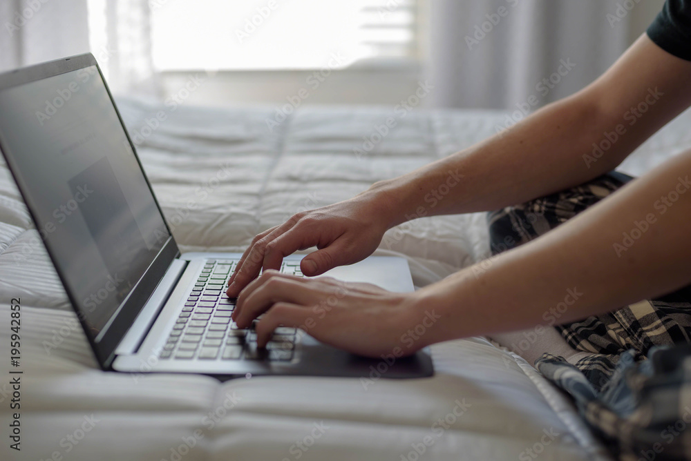 Fototapeta premium Student working on laptop in morning light