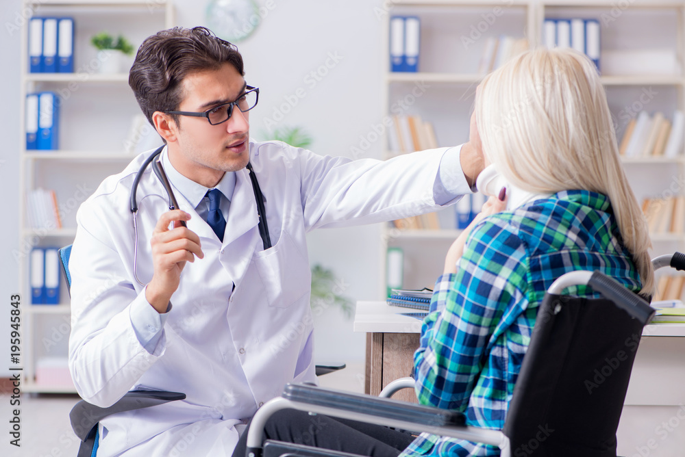 Disabled woman in wheel chair visiting man doctor Disabled woman in wheel chair visiting man doctor