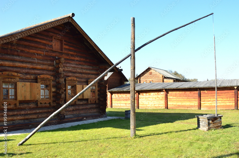 ancient well. Wooden architecture. Old Russian village. Wooden houses. Russia. Siberia ancient well. Wooden architecture. Old Russian village. Wooden houses. Russia. Siberia