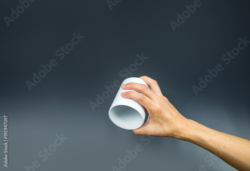 Empty coffee cup, hand holding upside down
