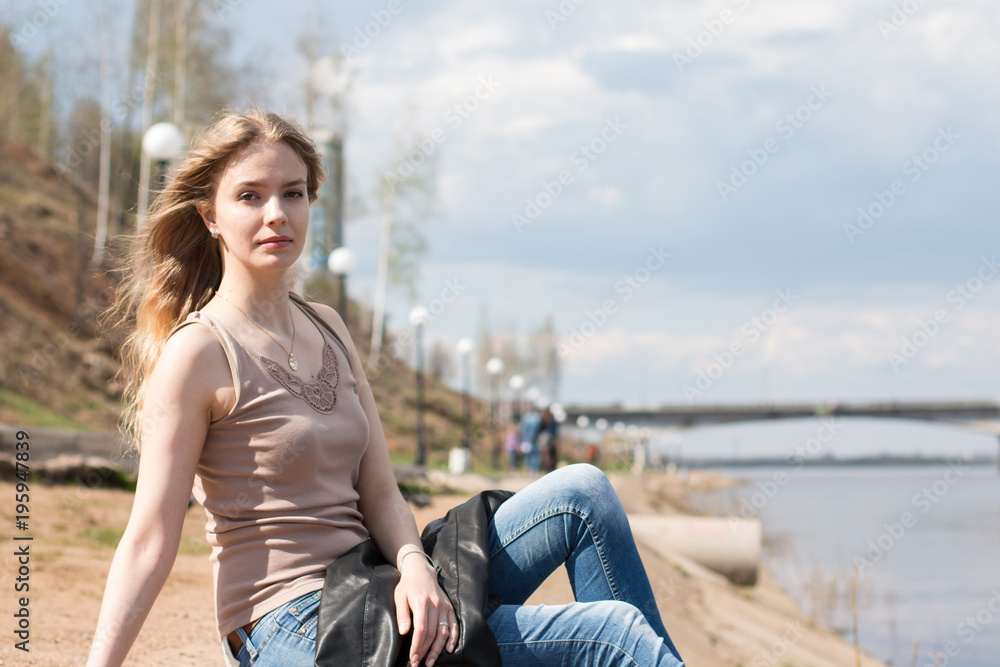 Girl with blond hair on the promenade