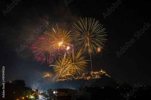 Landscape Scene of multicolor Fireworks annual festival over the Phra Nakhon Khiri (Khao Wang) which is ancient one of the landmark in Phetchaburi Province Thailand. Celebration concept © THANANIT