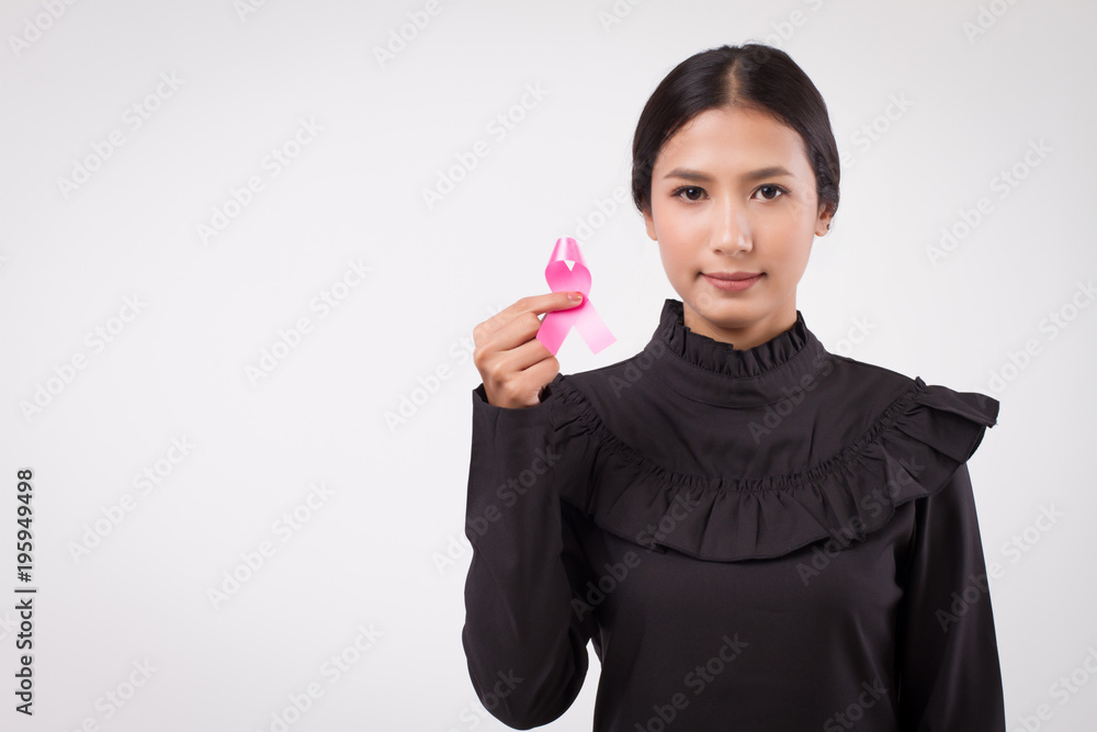woman hand holding pink ribbon bow, breast cancer awareness symbol, breast cancer day; pink ribbon for medical, charity fund raising concept for breast cancer patient or prevention woman hand holding pink ribbon bow, breast cancer awareness symbol, breast cancer day; pink ribbon for medical, charity fund raising concept for breast cancer patient or prevention