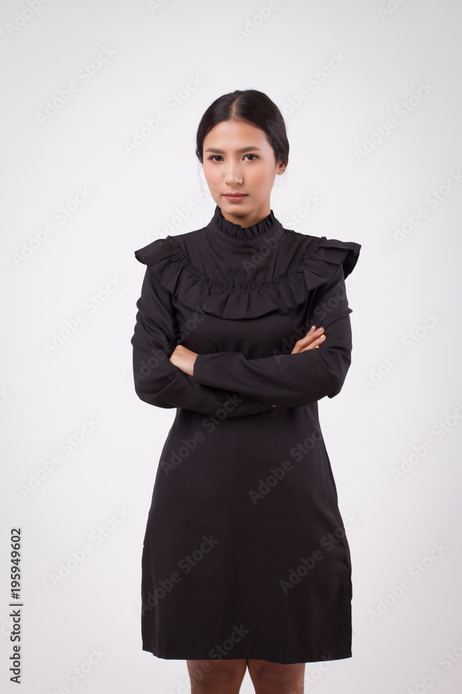 Fototapeta premium happy smiling confident woman portrait; relaxed positive happy woman smiling studio isolated; woman smiles with happy confident face expression; adult asian woman model