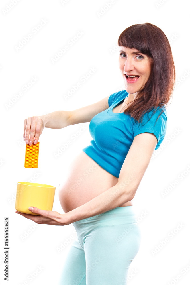 Woman in pregnant throwing medical pills or tablets, reduction of using pharmaceuticals during pregnancy Woman in pregnant throwing medical pills or tablets, reduction of using pharmaceuticals during pregnancy