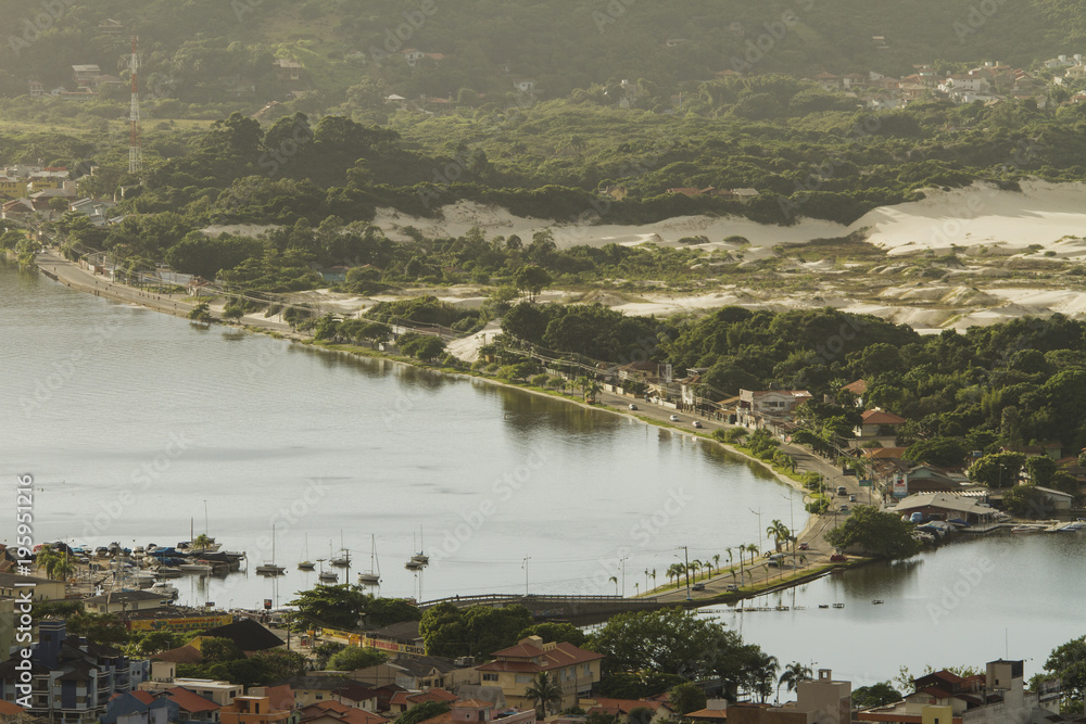 Panoramic view of Lagoa da Conceição in the morning, 'Rendeiras' avenue and bridge. Florianópolis. Santa Catarina, Brazil