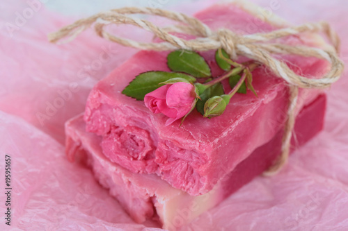 Rose Handmade Soap.Soap with Rose Extract. handmade soap pink with roses on pink crumpled paper. Organic Vegetable Cosmetics Concept.vegan soap with rose fragrance