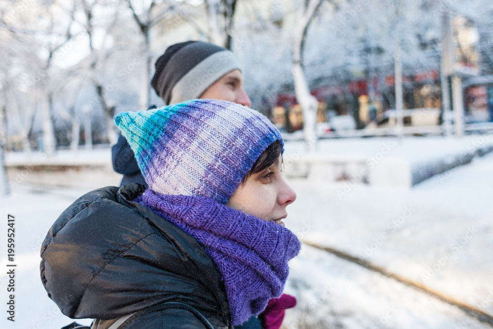 A couple is walking around the city. A couple is walking around the city.