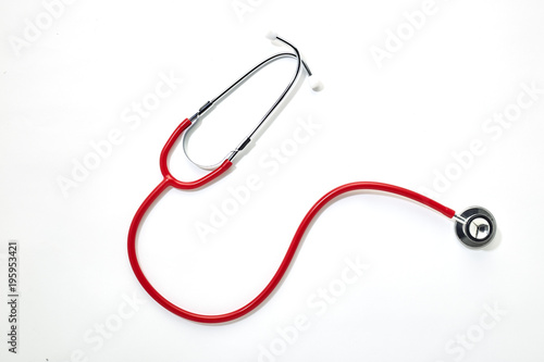 Red stethoscope on white background